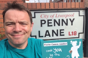 Image of Phil at Penny Lane sign, Liverpool